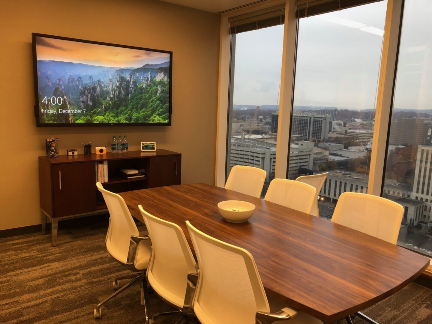 A large conference room with a view of the city.